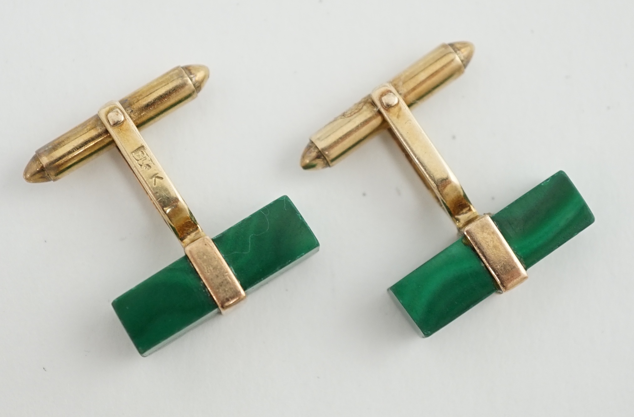 A pair of Chinese 9k gold and malachite set cufflinks